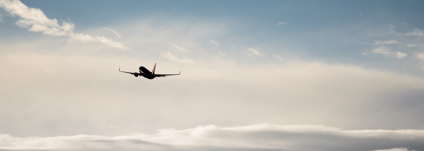 plane flying above the clouds