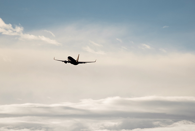 plane flying above the clouds