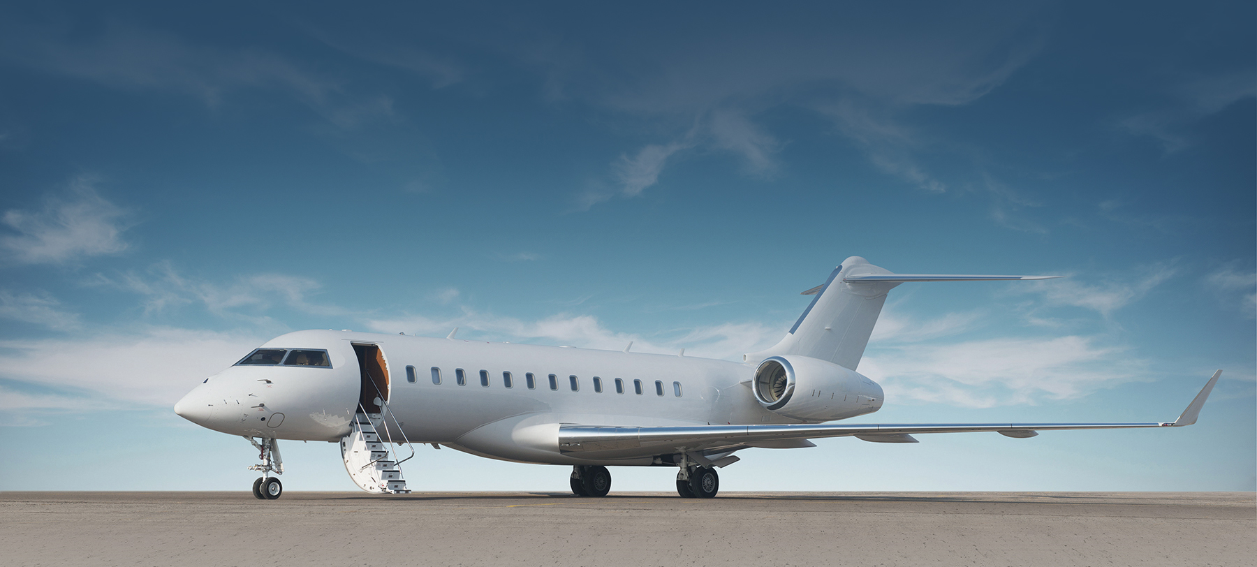 airplane on tarmac in front of blue sky